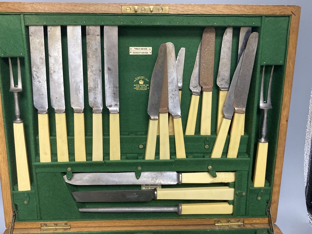 A Mappin & Webb service of plated flatware in an oak canteen